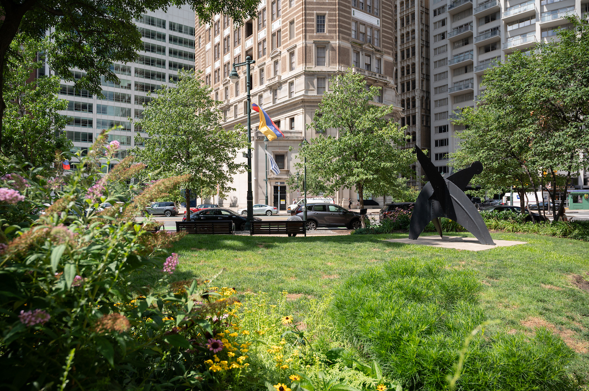 Grassy area in Cret Park with sculpture