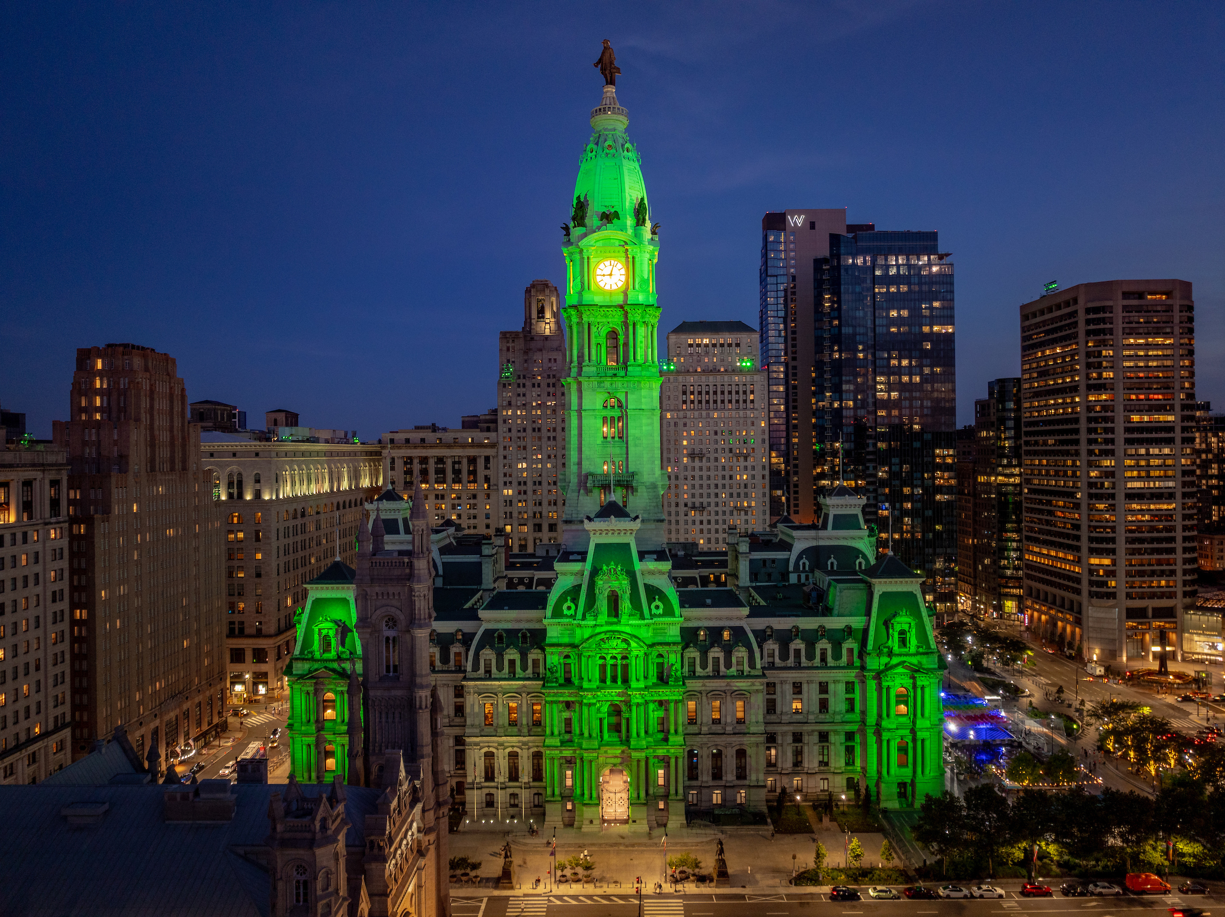 Philadelphia's City Hall lit with green in support of the Eagles at night.