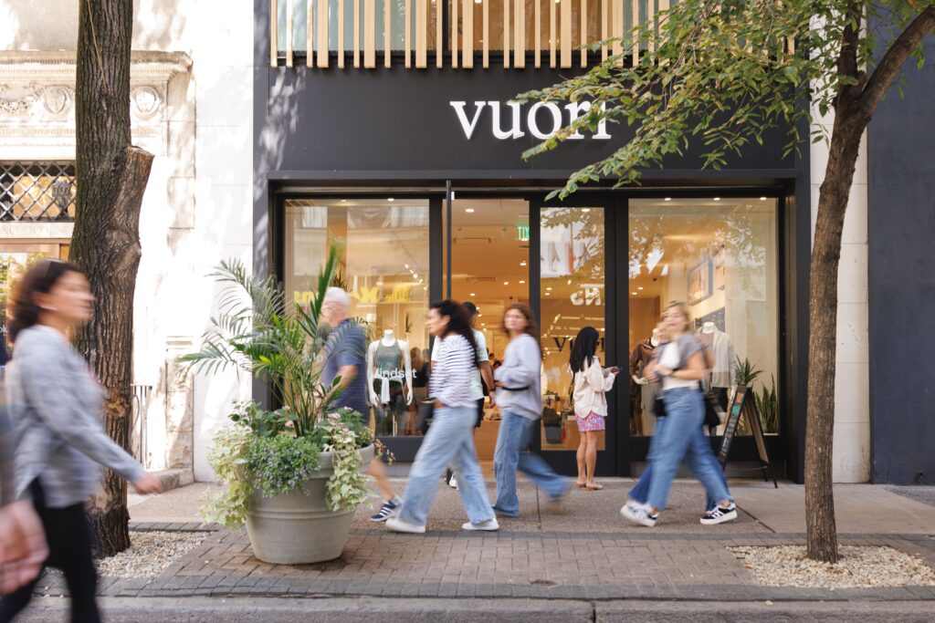 Vuori store exterior with people walking by.