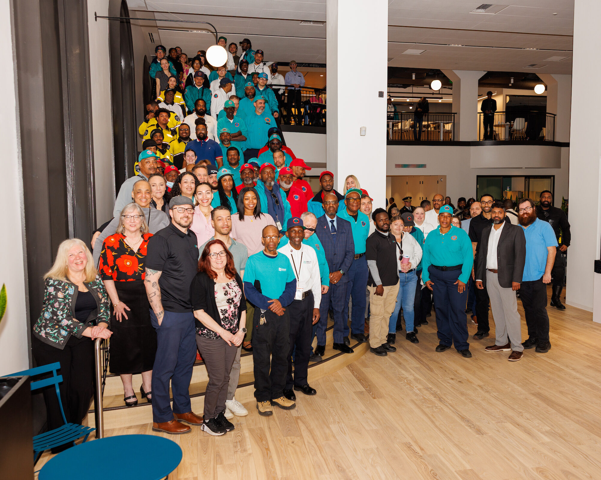 Center City District staff photo which includes the administrative staff, Community Service Representatives, sidewalk cleaning maintenance staff, outreach workers, public safety bike patrol and park staff.