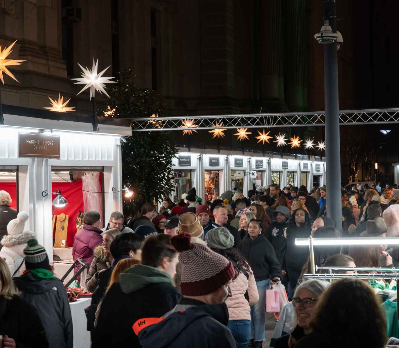 Crowd of people holiday shopping at outdoor market in philadelphia